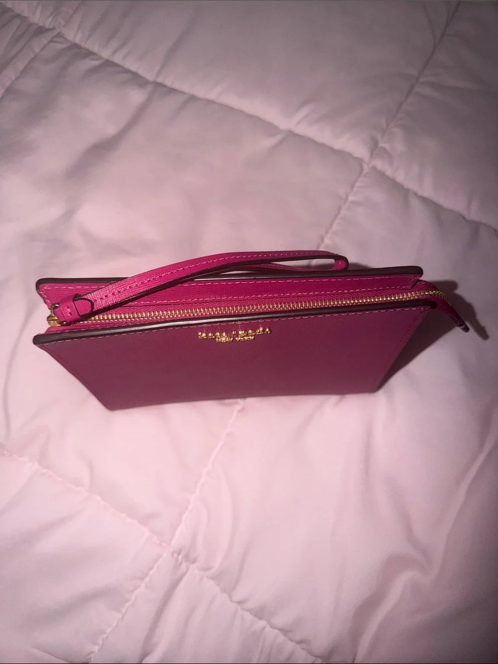 kate spade magenta wristlet clutch with gold logo